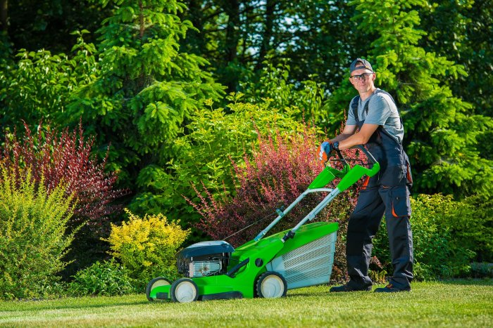 A gardener is mowing a 20 by 40 yard